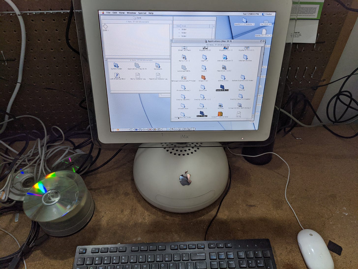 An iMac G4 with mouse and keyboard, on a desk. An iMac G4 with mouse and keyboard, on a desk.