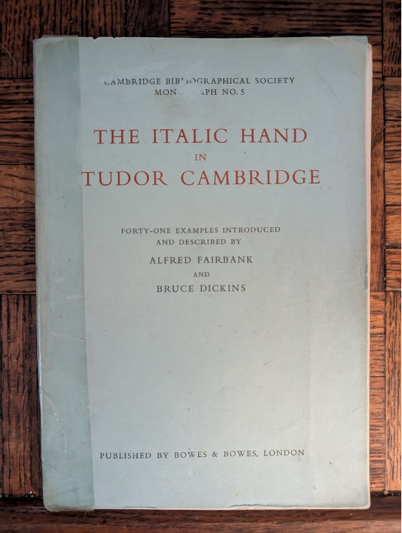 A book on a wood surface

AI-generated content may be incorrect.