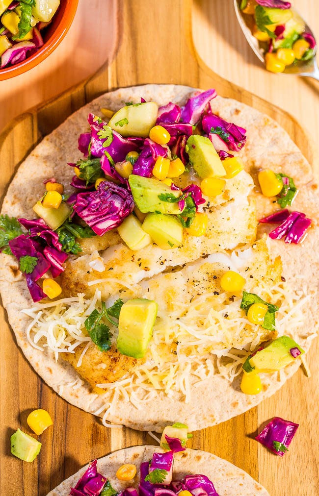 15-Minute Tilapia Fish Tacos with Corn Salsa — Tons of big flavors in a fast, fresh, and healthy meal!! A clean-eating taco recipe that tastes like comfort food!
