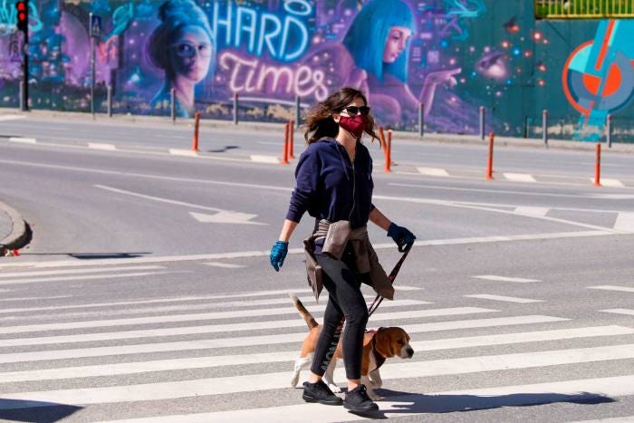 A passer-by wears a mask in Pristina. Many in Kosovo say poor governance has played a role in the rising infection rate, say analysts A passer-by wears a mask in Pristina. Many in Kosovo say poor governance has played a role in the rising infection rate, say analysts
