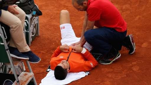 novak djokovic gets his groin worked on by medics at french open 2015 novak djokovic gets his groin worked on by medics at french open 2015