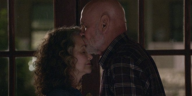 Walker Bonham giving Abiline a deep kiss on forehead. Walker Bonham giving Abiline a deep kiss on forehead.