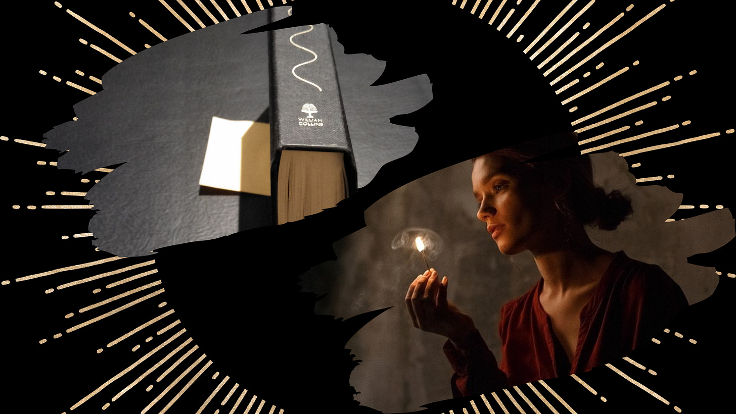 A book on its edge and a photo of a woman gazing at a lit match A book on its edge and a photo of a woman gazing at a lit match