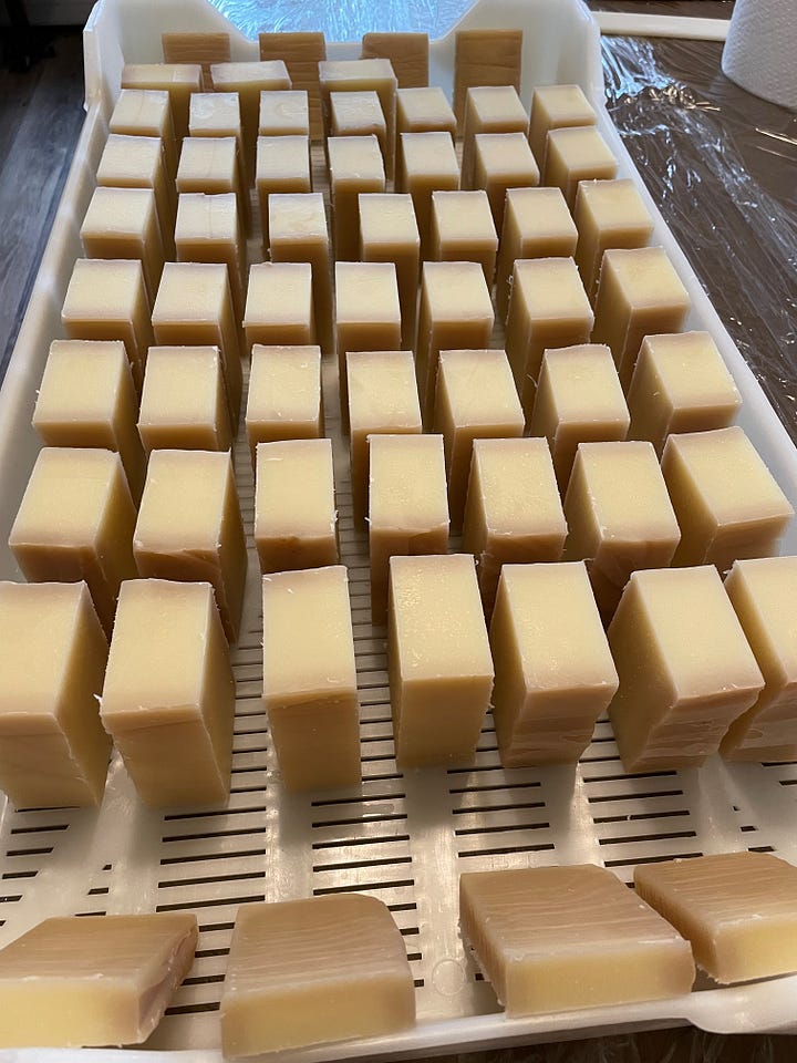 batches of soap on drying racks