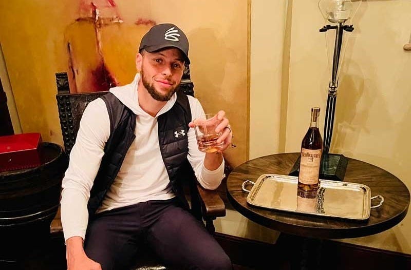 Stephen Curry with a glass of Gentleman's Cut Bourbon