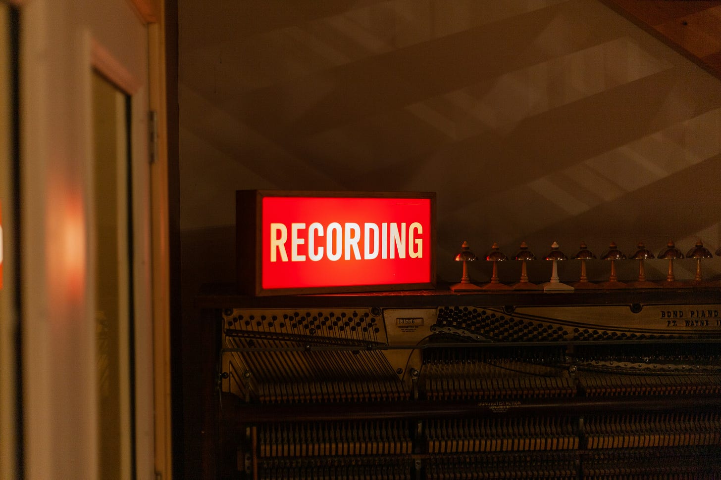 A lit recording sign. A lit recording sign.
