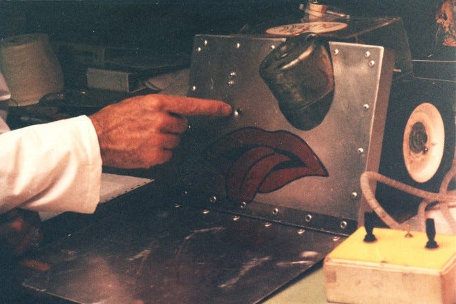 We see a grainy close up photo of a robot with battle damage. We see a grainy close up photo of a robot with battle damage.