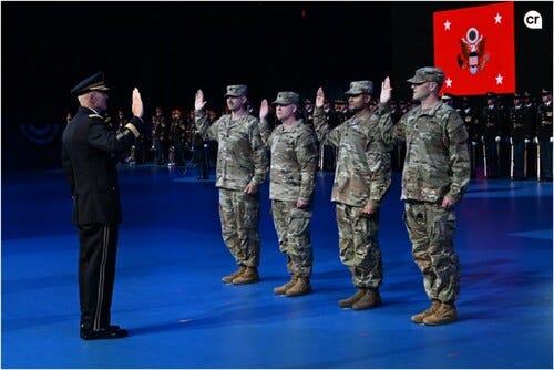 A photo of Gen. Randy A. George administering an oath to four uniformed officers standing with raised hands on a blue-lit stage. A photo of Gen. Randy A. George administering an oath to four uniformed officers standing with raised hands on a blue-lit stage.