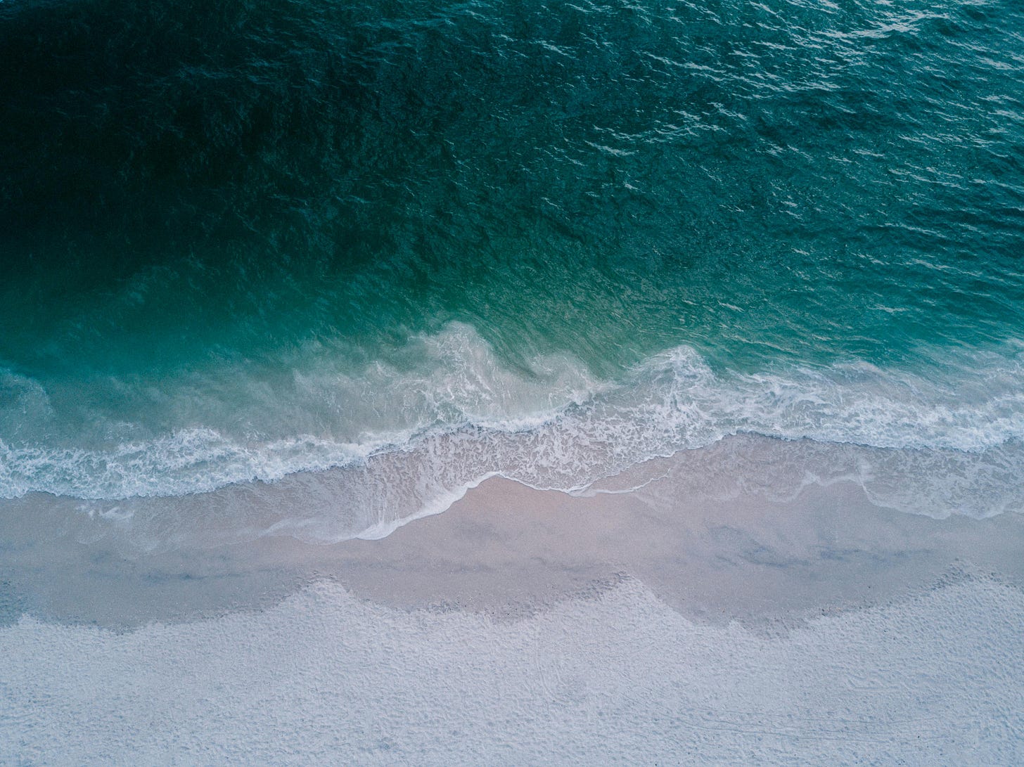 Body of Water Beside Beach Sand by Josh Sorenson Body of Water Beside Beach Sand by Josh Sorenson