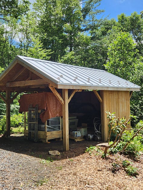 Photos of the WoolTribe Studio Cabin renovation project, showing a cabin with new standing seam metal roof, as well as interior shots of the studio with new drop ceiling tiles.