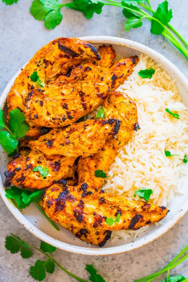 Grilled Tandoori Chicken with rice in white bowl Grilled Tandoori Chicken with rice in white bowl