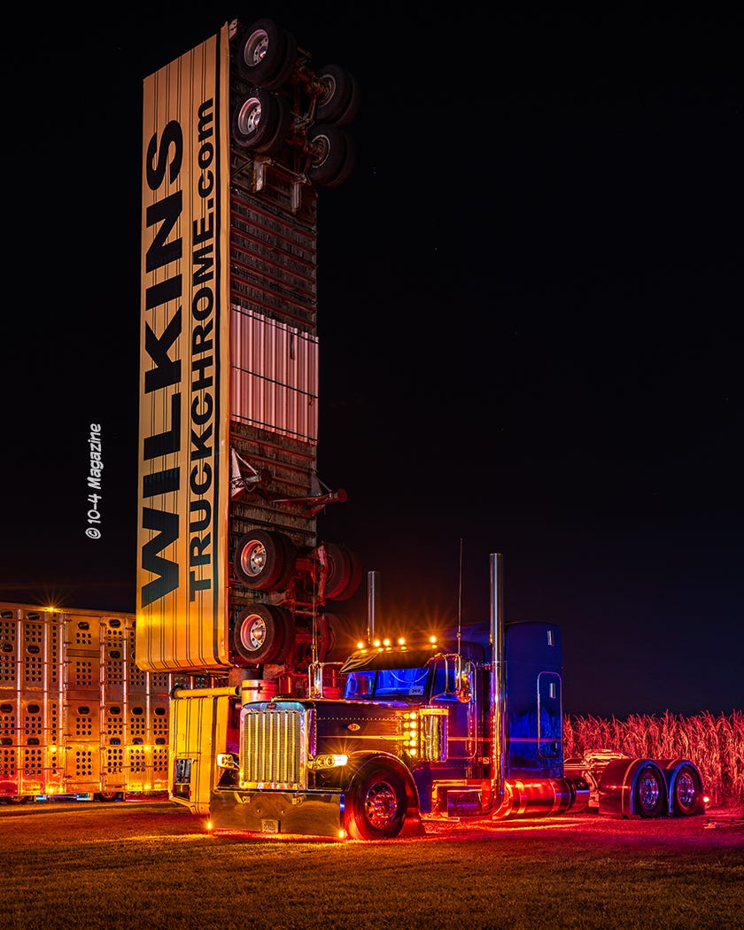 night time view of the wilkins verticle semi truck and another semi truck. night time view of the wilkins verticle semi truck and another semi truck.