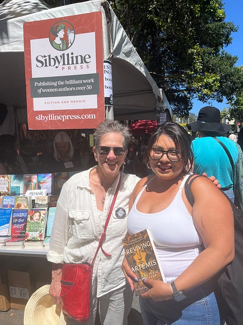 Deborah Lee Luskin with colleagues, book buyer, readers at Rhoda Goldman Plaza