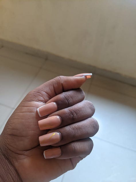6 Images of fingers with different nail polish.