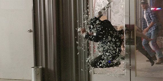 Walker Cordell chasing bad guy through plate glass window 217 Walker Cordell chasing bad guy through plate glass window 217