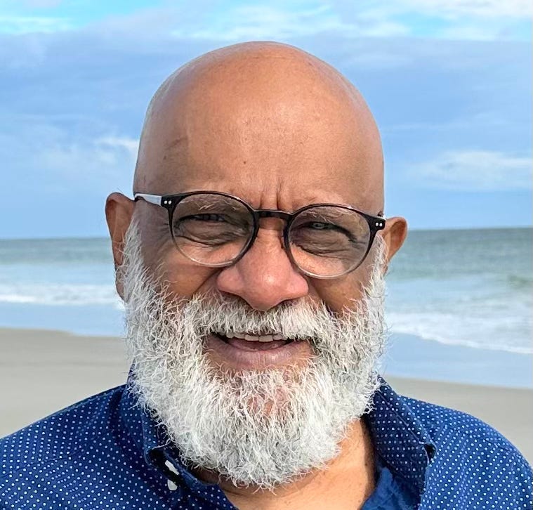 A person with a beard and glasses on a beach

AI-generated content may be incorrect.