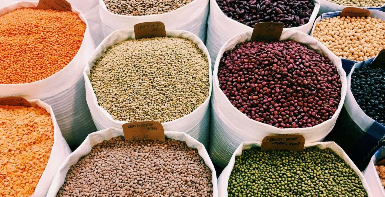 Different coloured lentils for sale. Eating a healthy diet, including legumes, helps nurture the gut microbiome Different coloured lentils for sale. Eating a healthy diet, including legumes, helps nurture the gut microbiome