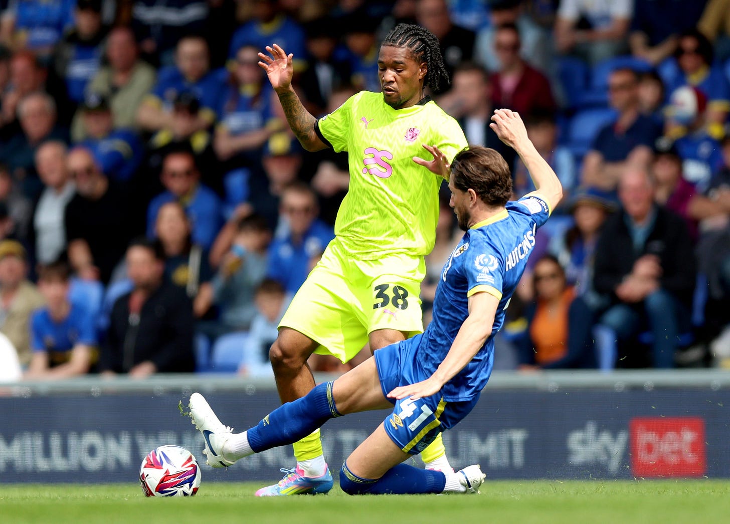 <p>AFC Wimbledon's Sam Hutchinson has undergone surgery to place a stent in a blocked artery after he fell ill</p>