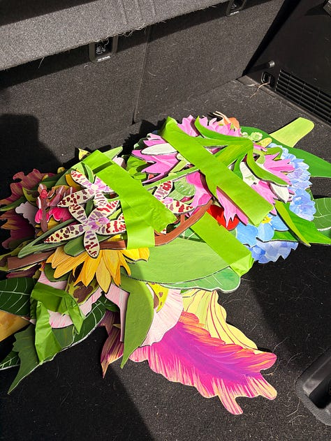 Flower artworks in the car, a sprinkle doughnut, Australianarama on screen