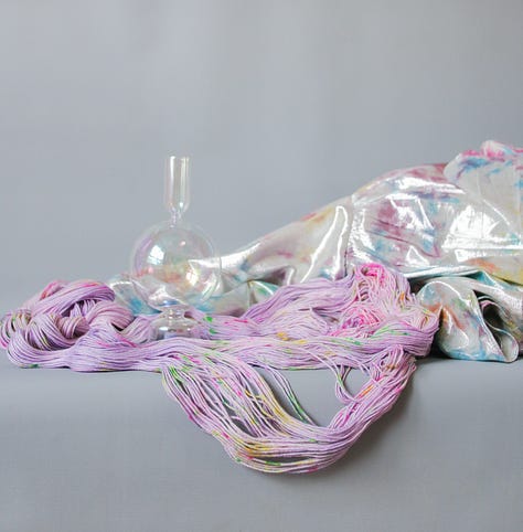 A series of images of colourful yarn with a surrealist, sci fi, and vintage aesthetic.