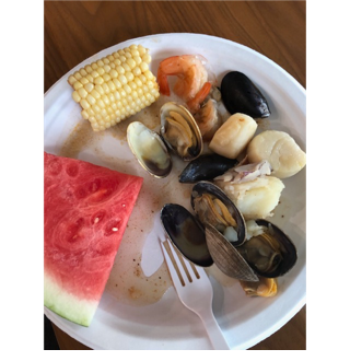 A plate of seafood and watermelon

AI-generated content may be incorrect.
