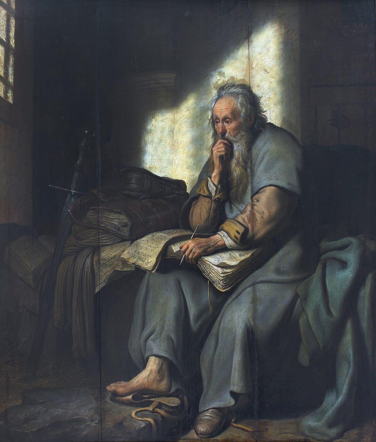 Rembrandt's Apostle Paul in prison: a bearded old man sits in a dim stone cell, lit by a shaft of light from one side Rembrandt's Apostle Paul in prison: a bearded old man sits in a dim stone cell, lit by a shaft of light from one side