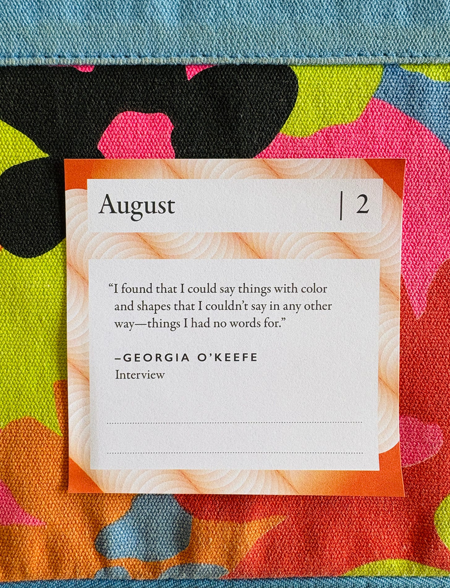 Floral background with Georgia O'Keefe quote laying on it. "I found that I could say things with color and shapes that I couldn't say in any other way - things I had no words for."