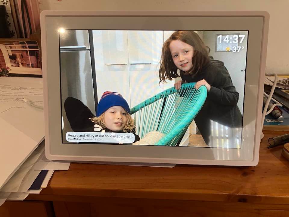 May be an image of 2 people, television and text