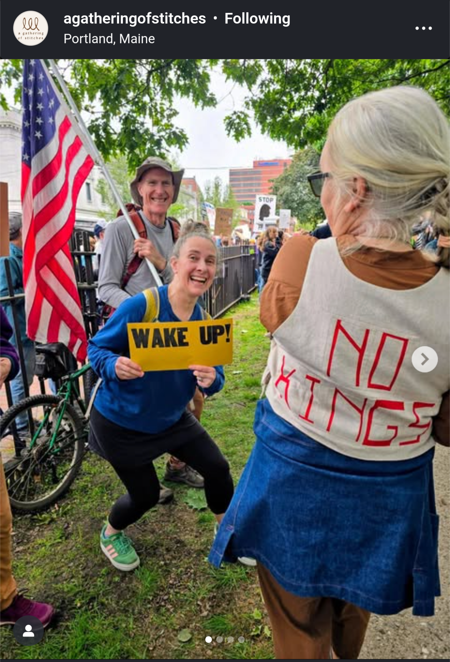 Screenshot of an Instagram post from Samantha Hoyt / A Gathering of Stitches. It is a photo from the Portland, Maine No Kings protest. Sam is wearing a vest with "No Kings" sewn into the back, which she made herself. I am standing behind her holding a sign that says "Wake Up!" My husband, Dave, is behind me, holding an American flag. Screenshot of an Instagram post from Samantha Hoyt / A Gathering of Stitches. It is a photo from the Portland, Maine No Kings protest. Sam is wearing a vest with "No Kings" sewn into the back, which she made herself. I am standing behind her holding a sign that says "Wake Up!" My husband, Dave, is behind me, holding an American flag.