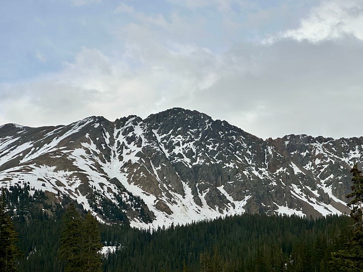 Photo of semi trucks ascending and descending Loveland Pass
