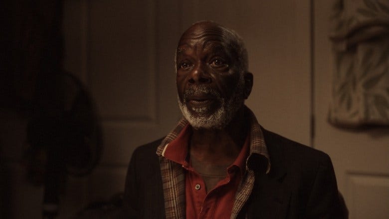 a still from the film "seahorse" - a close up of actor Joseph Marcell's face. 