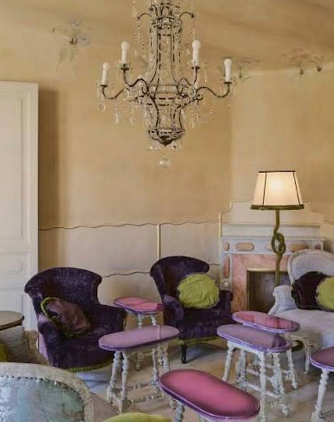 yellow dining room., blue kitchen, stairwell, two beds with canopy, living room and stairwell with tiles