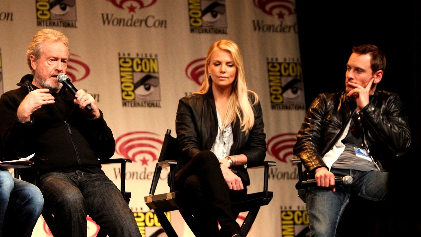 Ridley Scott, left, with Charlize Theron and Michael Fassbender at WonderCon. Image: Gage Skidmore via Wikimedia Commons
