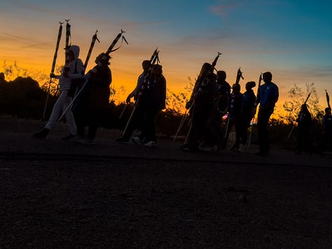Two women, mothers of fallen soldiers, stand side-by side, holding American flags that represent their fallen sons. An image gallery from that morning shows pictures of fallen soldiers, runners along the Papago Park trail and a beautiful desert morning.