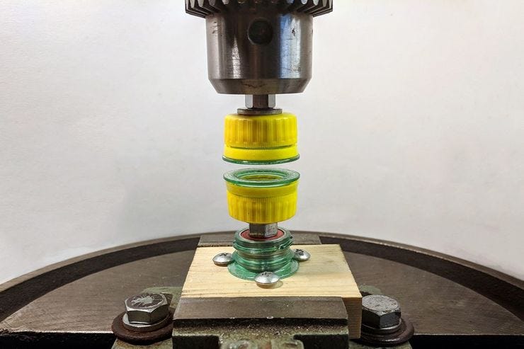 Spinning friction melts and fuses the plastic.