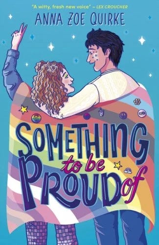 An image of a blue book called Something to Be Proud Of by Anna Zoe Quirke. Two characters stand holding a pride flag looking at stars.