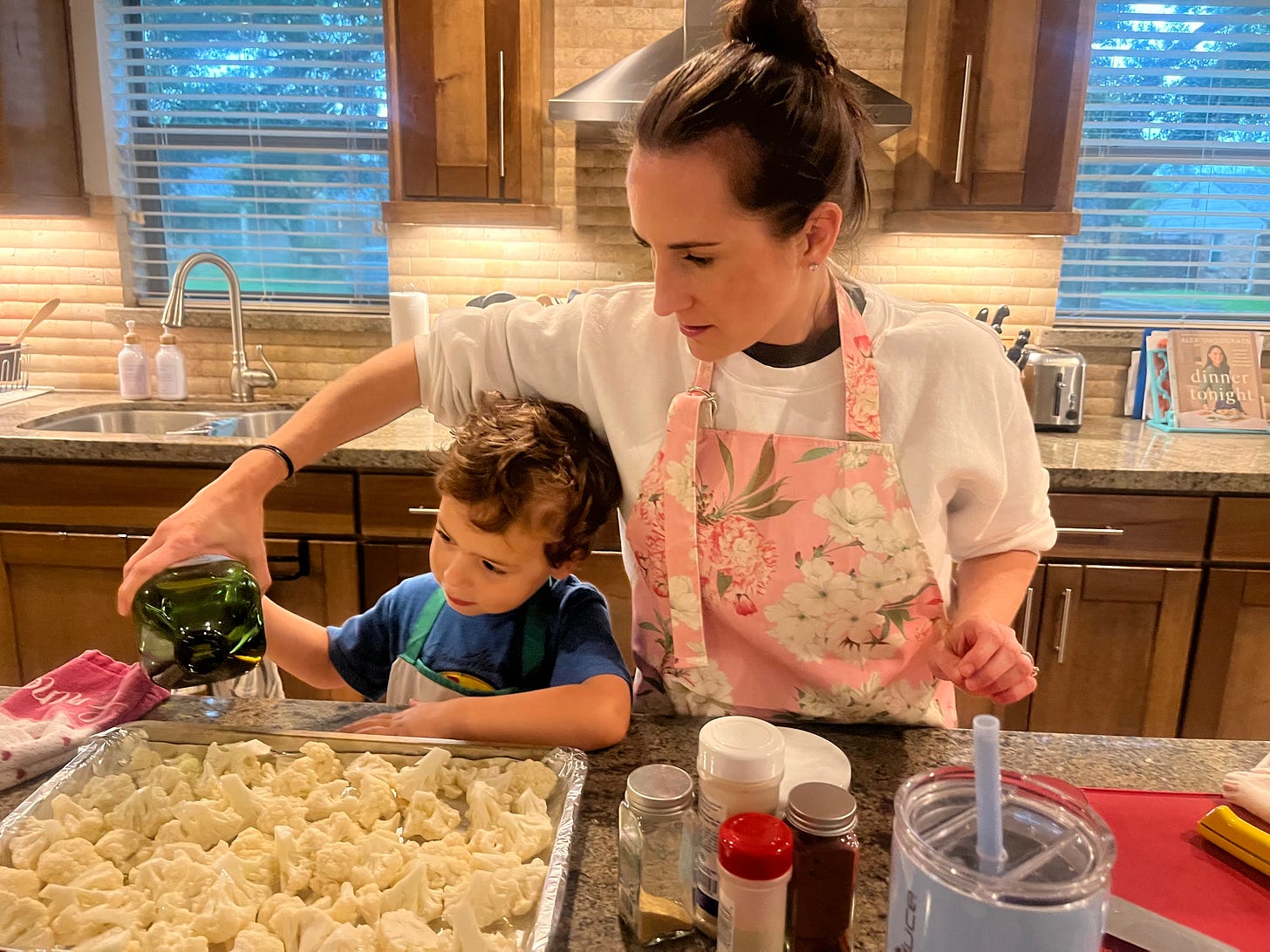 a mom and son cooking together