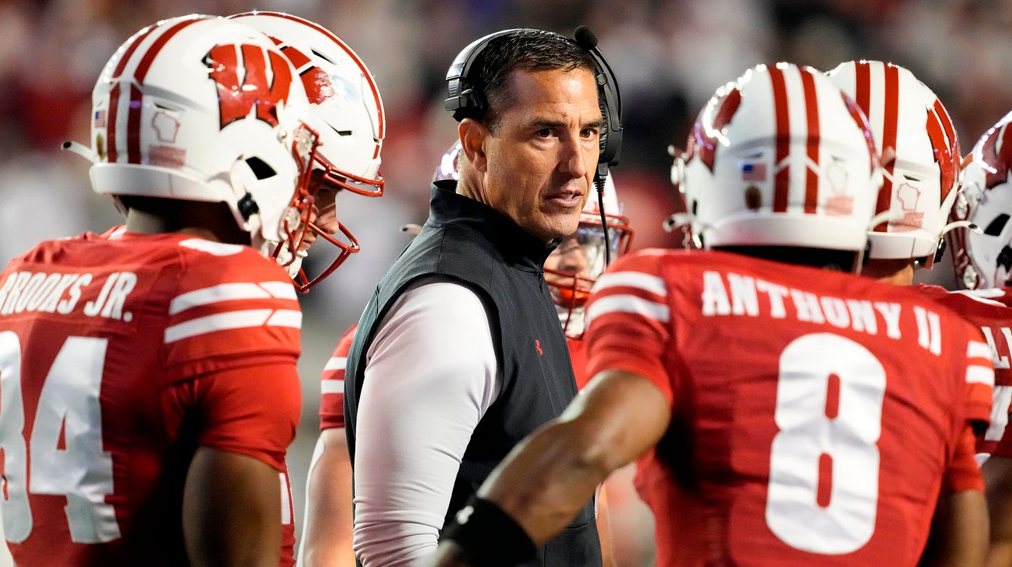 Wisconsin Badgers head coach Luke Fickell talks to players during the fourth quarter against the Penn State Nittany Lions at Camp Randall