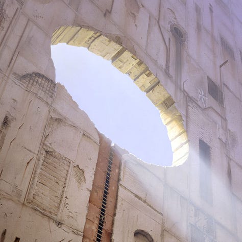 LEFT: Detail from LUMEN 4 featuring a tighter view of the oculus set in the massive stone wall. The perspective is dizzying as captured from a low angle and off-center. The way the light angles down through the opening on a diagonal suggests the lens of a magnifying glass. The recess in the stone facade leading down from the oculus differs in color from the bleached concrete, creating a copper-colored line suggesting a handle attached to the oculus. CENTER: Detail from LUMEN 4 centering on the figure, tiny in scale, climbing a makeshift ladder of boards that is mounted across the gap between rust colored concrete that lead up to the oculus. RIGHT: Close detail from LUMEN 4 featuring the pitted concrete facade. Lines of rust bleed down from holes in the concrete, metal plates, and rebar jutting out of the surface. A recess cuts through the facade with boards tacked across the dark channel in between to form a makeshift ladder. In the bottom left of the panel is the artist’s signature, the letters M and W bound within a circle, etched light on a dark rusted plate of metal.
