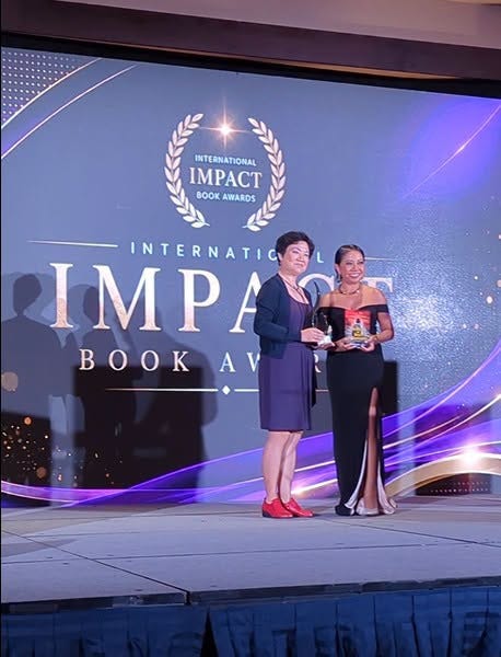May be an image of text that says 'INTERNATIONAL MPACT BOOKAWARDS BOOK AWARDS L INTERNATIC ΙΜΡΑ ΡΑ P BOA AV'