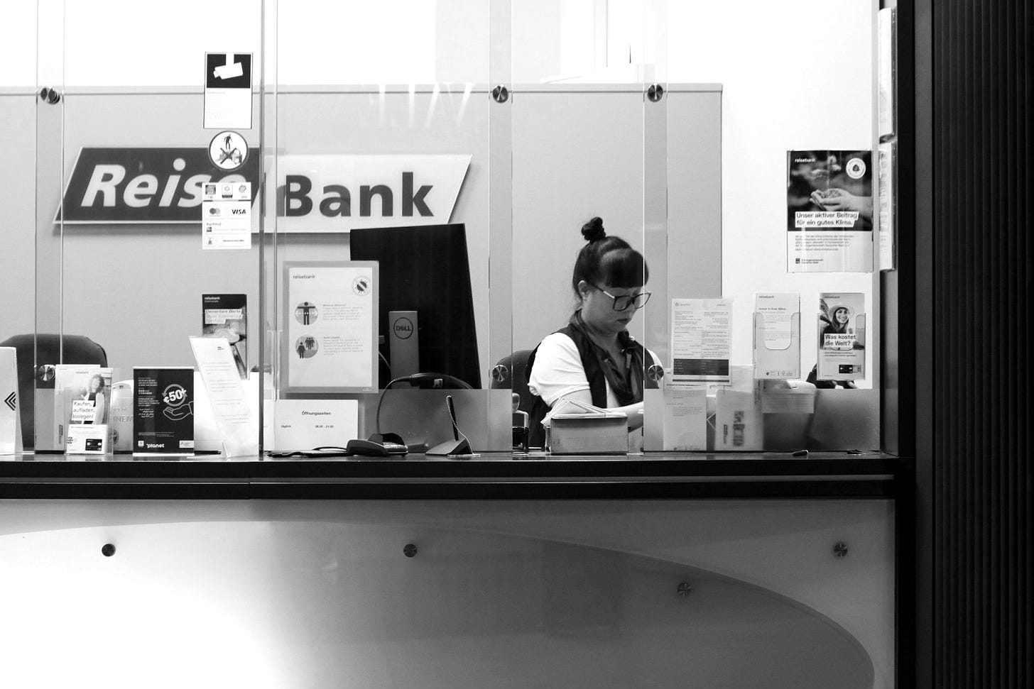 a man sitting at a desk a man sitting at a desk