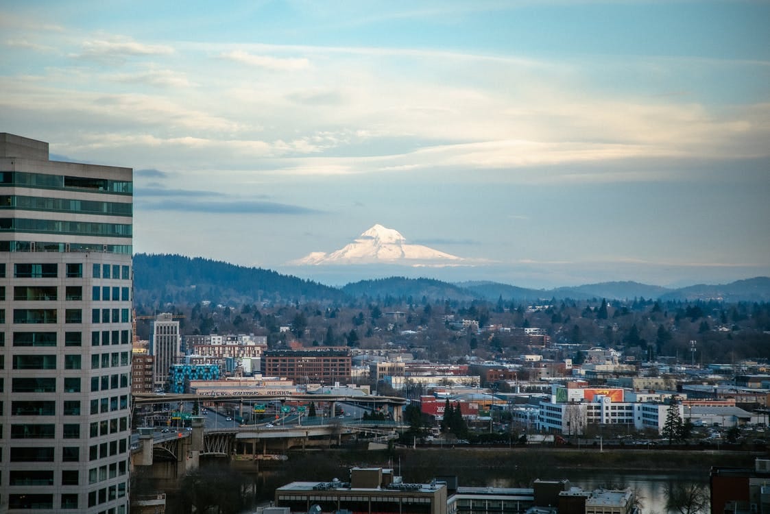 Free City With High Rise Buildings Under White Clouds and Blue Sky Stock Photo