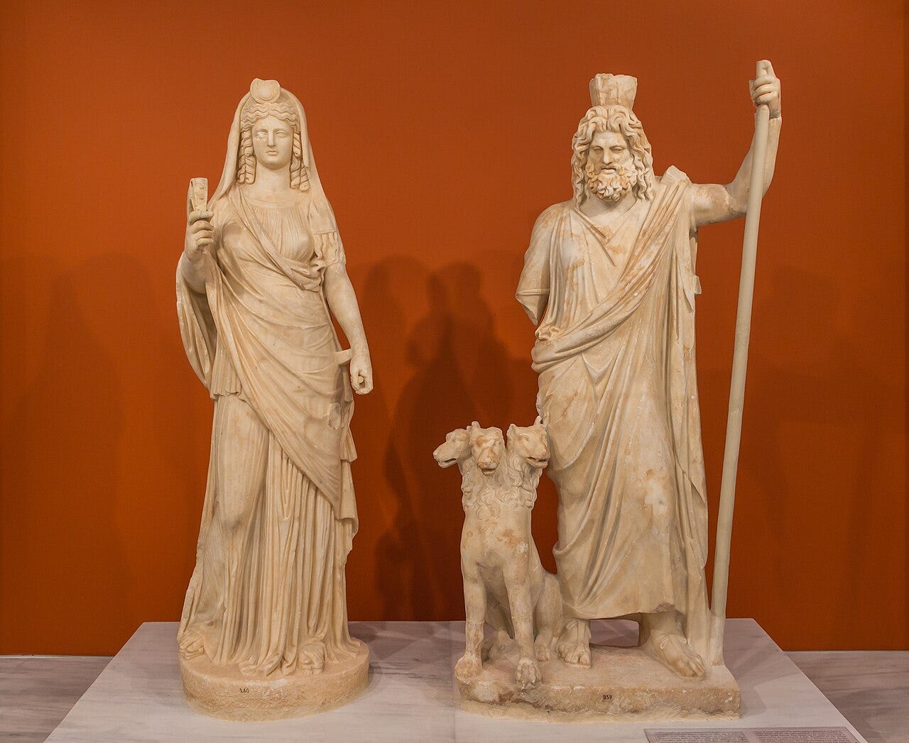 Pluto gripping Proserpina