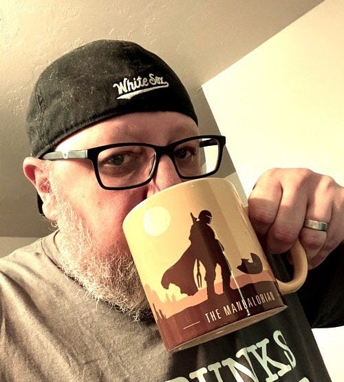May be an image of 1 person, beard, coffee cup, briar and text