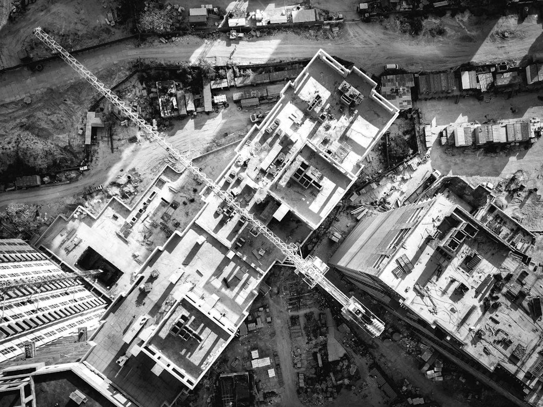 aerial view photography of vehicles and buildings during daytime aerial view photography of vehicles and buildings during daytime