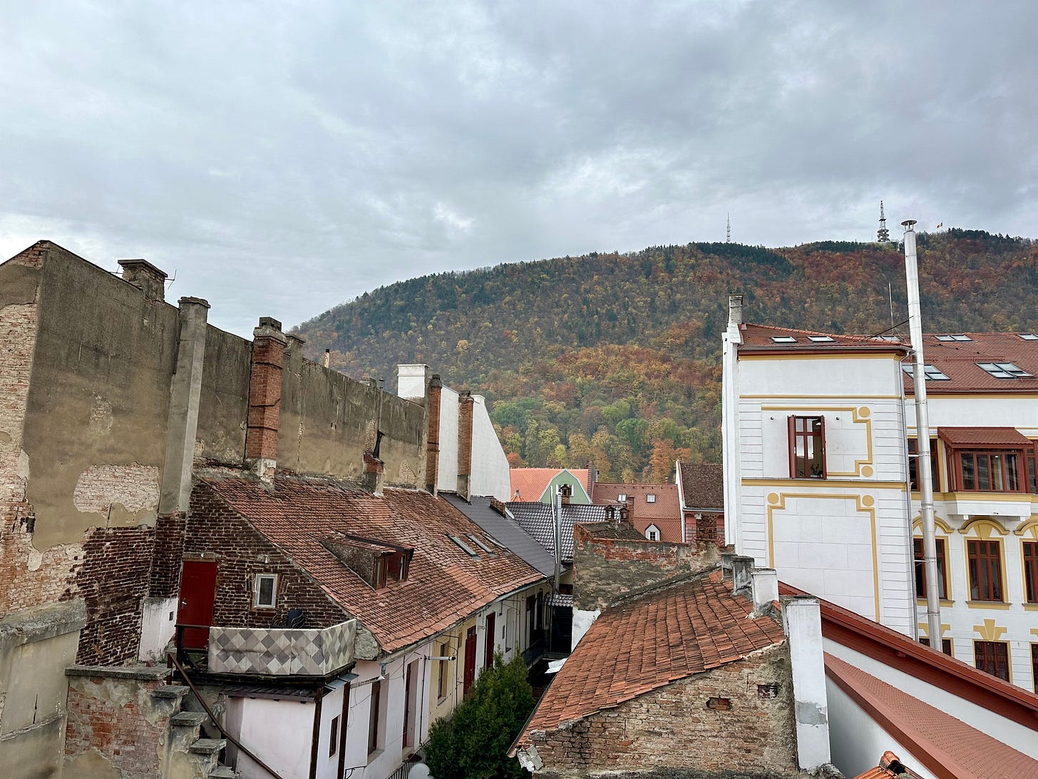 Watching the autumn colors of Brasov from our rooftop balcony