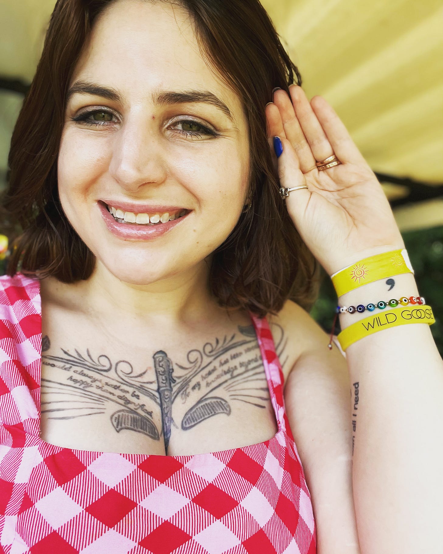 The author (Jennifer Martin) is smiling and wearing a pink top with a wild goose bracelet visible