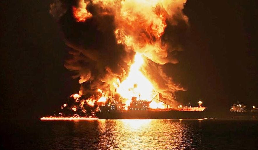 An oil tanker burns after being hit by an Iranian strike in the ship-to-ship transfer zone at Khor al-Zubair port near Basra, Iraq, late Wednesday, March 11, 2026. (AP Photo)