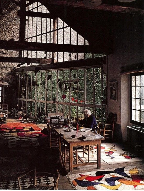 Alexander Calder in his studio. I want those rugs!