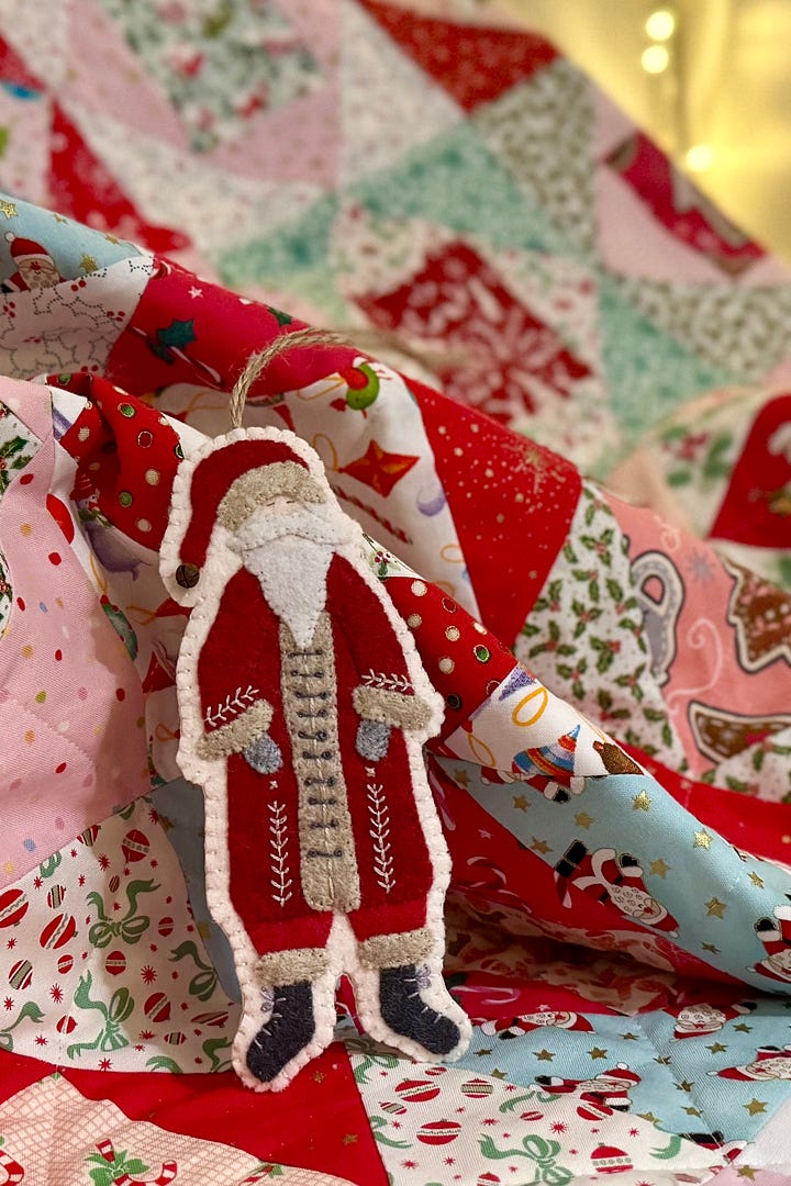 A Father Christmas stitched from felt and set of 3 white doilies with gold trim.